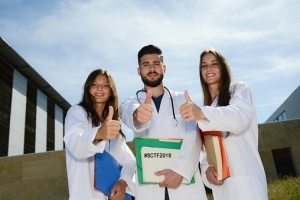 group of young happy medical students on hospital university campus